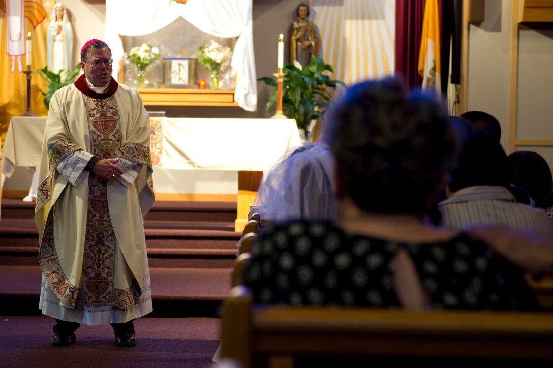 Most Reverend Neal J. Buckon, Auxiliary Bishop of the Archdiocese for the Military Services, speaks with families during a religious service May 4, 2016, at Fairchild Air Force Base, Wash. During his visit at Fairchild Buckon spoke about the importance of the Chaplain Corp and the effect Chaplains have on the mission. (U.S. Air Force photo/Airman 1st Class Nick J. Daniello)