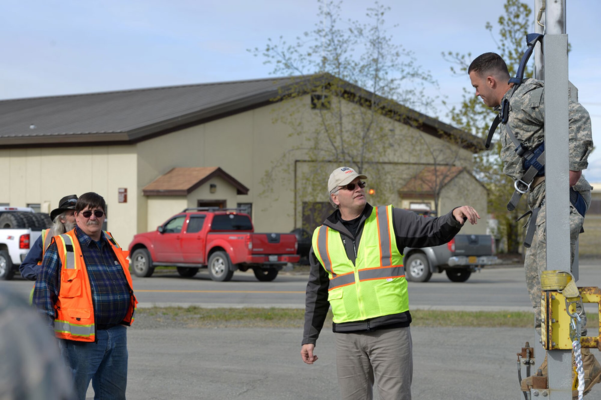 Trace Savage, a fall protection manufacturer representative with 3M, hoists a volunteer during a fall protection awareness presentation at the civil engineer compound on Joint Base Elmendorf-Richardson, Alaska, May 4, 2016. There is an annual requirement on JBER for all individuals who work in elevated locations above four feet to be trained on aspects of fall protection, said Staff Sgt. Johnathan Murphy, 673d Air Base Wing Safety Office occupational safety technician. (U.S. Air Force photo by Airman 1st Class Javier Alvarez)