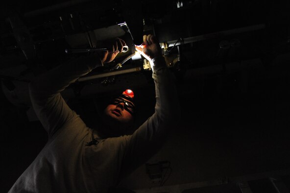 U.S. Air Force Senior Airman Brandon Anderson, a 393d Aircraft Maintenance Unit (AMU) load crew member, prepares the bomb rack sway pads prior to loading an AGM-158 Joint Air-to-Surface Standoff Missile during a weapons load competition at Whiteman Air Force Base, Mo., April 27, 2016. Total Force Airmen from the 131st and 393d AMU competed in the competition to test the crews’ ability to load weapons in a timely manner. (U.S. Air Force photo by Airman 1st Class Keenan Berry)