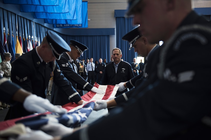U.S. Air Force Vice Chief of Staff Gen. David L. Goldfein watches the U.S. Air Force Honor Guard Body Bearers Flight demonstrating the folding of the American flag during an 11th Operations Group immersion tour at Joint Base Anacostia-Bolling, Washington, D.C., May 3, 2016. Goldfein toured the 11th OG to meet Airmen and learn about the mission. (U.S. Air Force photo by Airman 1st Class Philip Bryant)