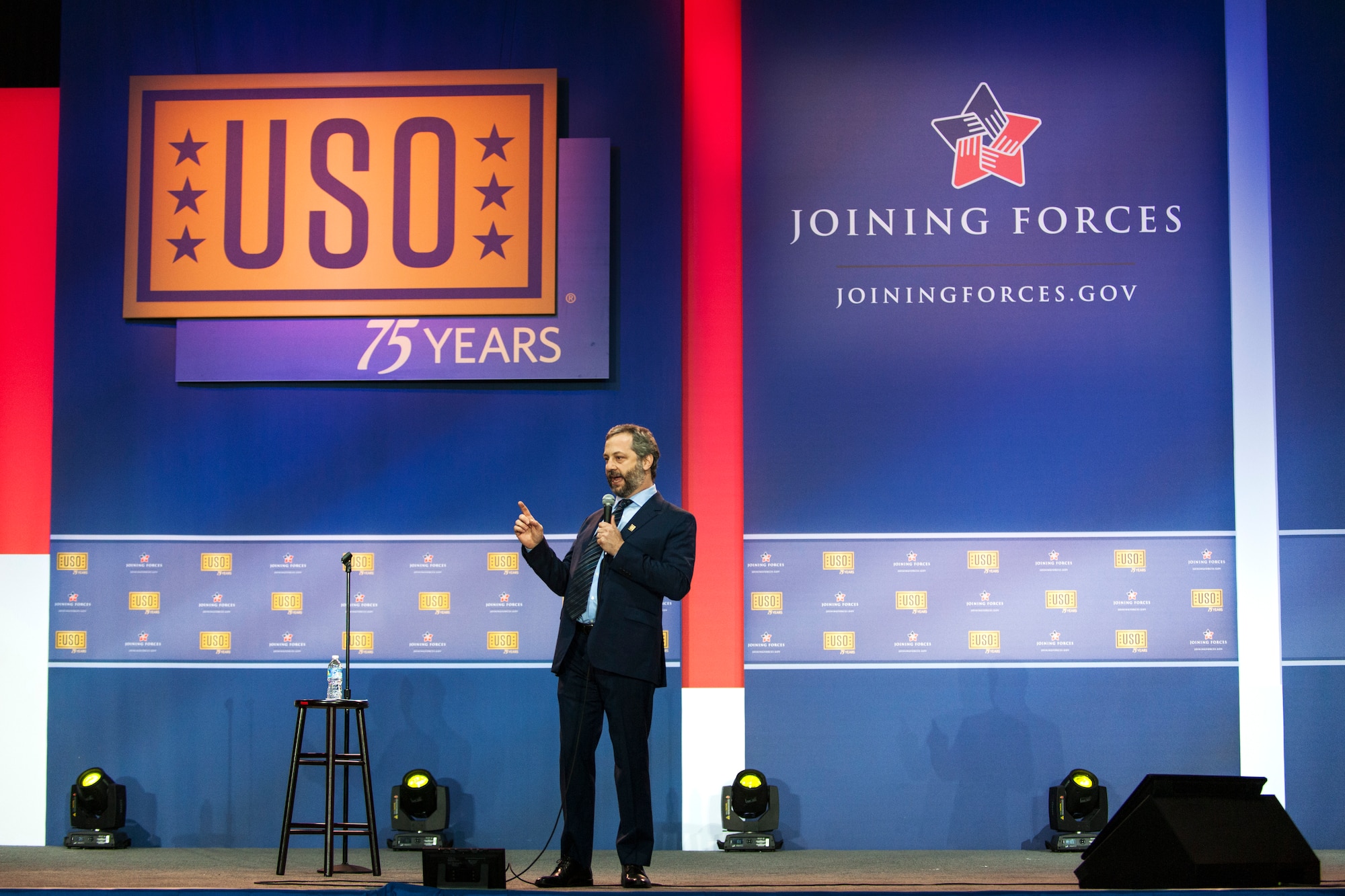 Judd Apatow, comedian, performs a comedy skit during the ‘Celebration of Service’ comedy show on Joint Base Andrews, Md., May 5, 2016. The show celebrated Military Appreciation Month, the 5th Anniversary of Joining Forces and the 75th Anniversary of the USO. Nearly 1,500 service members, veterans and their families were on hand to see performances by Judd Apatow, Mike Birbiglia, Kristen Schaal, Hasan Minhaj, John Mulaney and Jeff Ross. (U.S. Air Force photo by Airman 1st Class Philip Bryant)