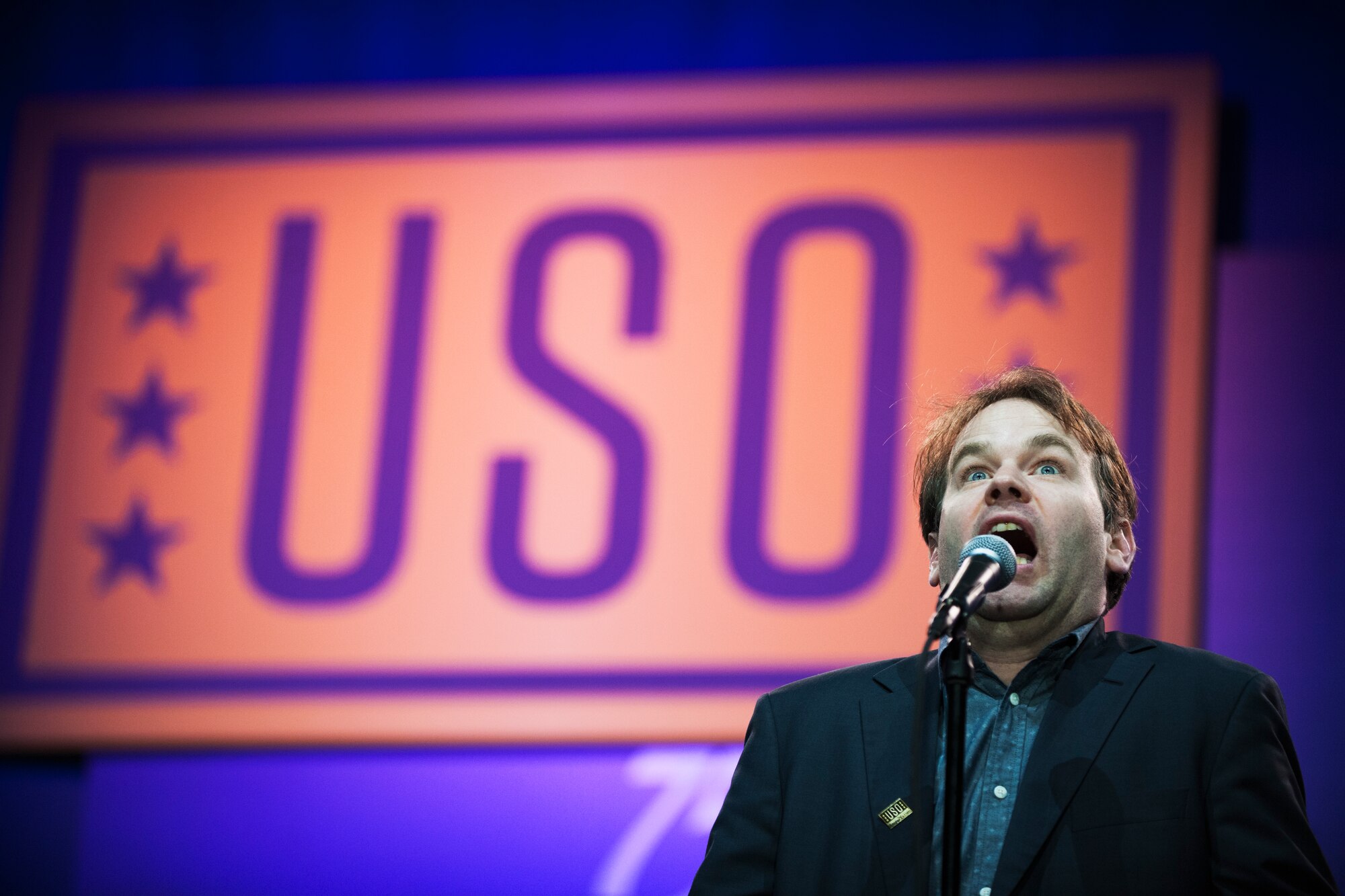 Mike Birbiglia, comedian, performs a comedy skit during the ‘Celebration of Service’ comedy show on Joint Base Andrews, Md., May 5, 2016. Birbiglia was one of six comedians who performed during the USO and Joining Forces event. Nearly 1,500 service members, veterans and their families were on hand to see performances by Judd Apatow, Mike Birbiglia, Kristen Schaal, Hasan Minhaj, John Mulaney and Jeff Ross. (U.S. Air Force photo by Airman 1st Class Philip Bryant)