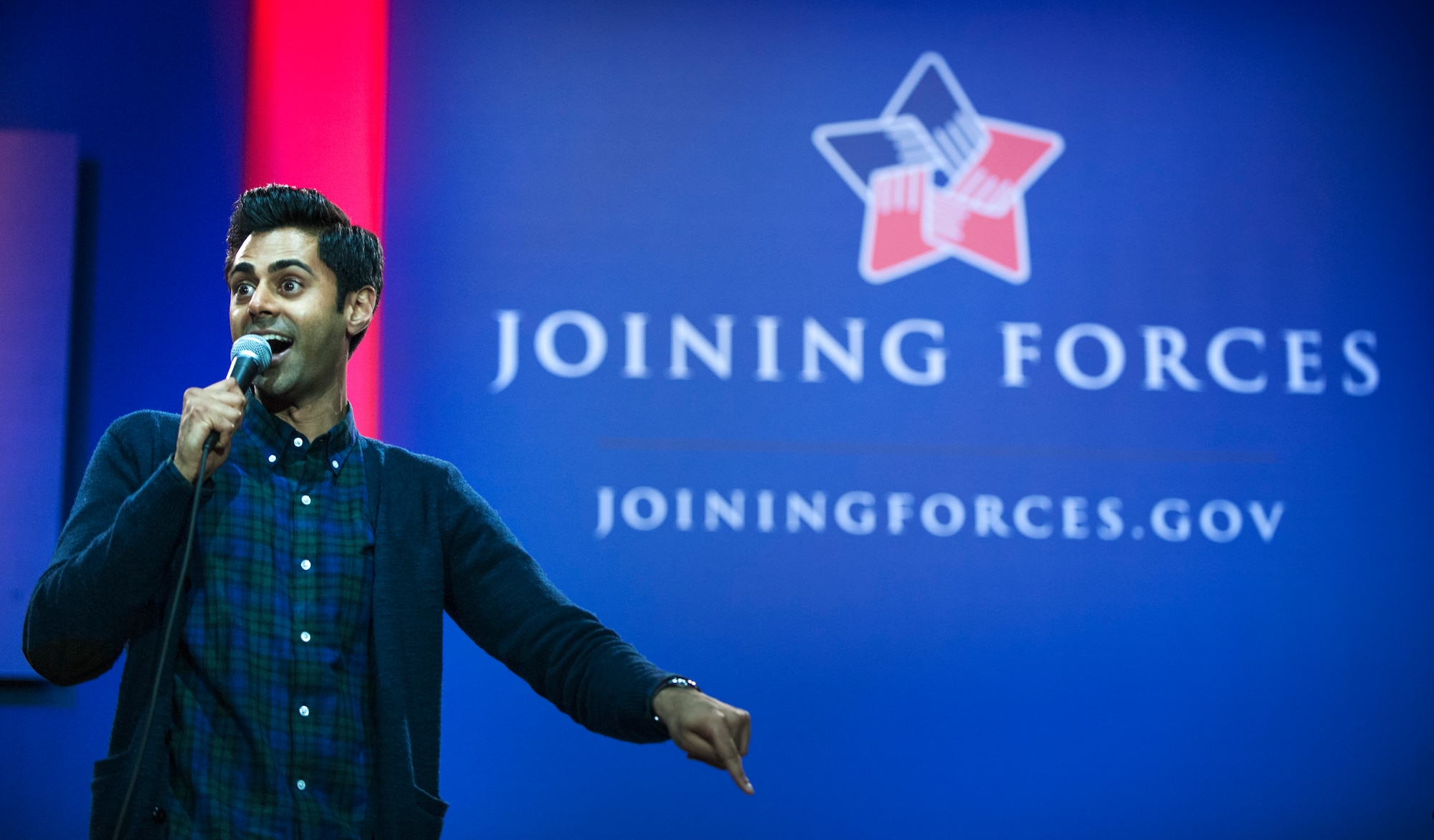 Hasan Minhaj, comedian, performs a comedy skit during the ‘Celebration of Service’ comedy show on Joint Base Andrews, Md., May 5, 2016. Minhaj was one of six comedians who performed during the USO and Joining Forces event. Nearly 1,500 service members, veterans and their families were on hand to see performances by Judd Apatow, Mike Birbiglia, Kristen Schaal, Hasan Minhaj, John Mulaney and Jeff Ross. (U.S. Air Force photo by Airman 1st Class Philip Bryant)