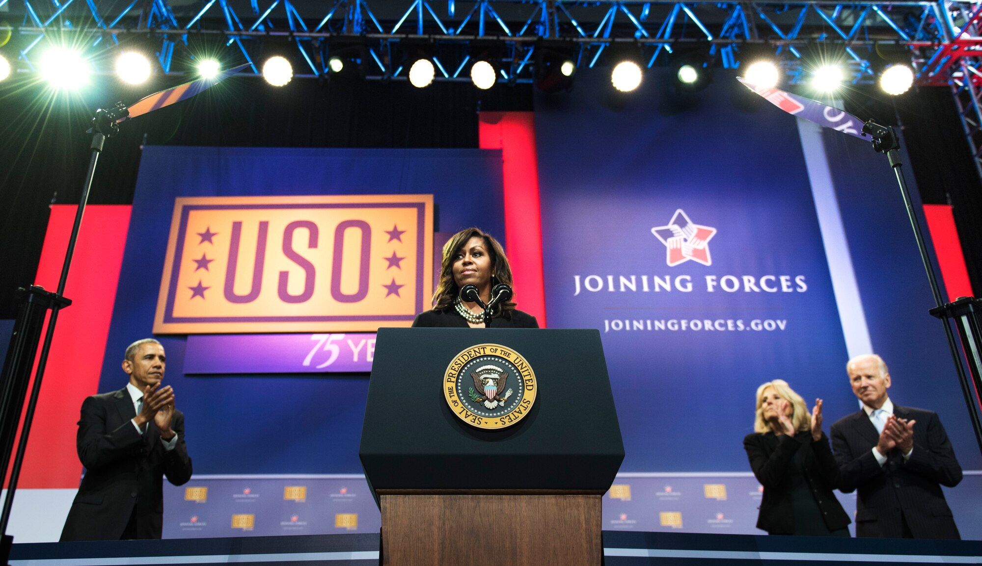 First Lady Michelle Obama speaks at the ‘Celebration of Service’ comedy show on Joint Base Andrews, Md., May 5, 2016. The show celebrated Military Appreciation Month, the 5th Anniversary of Joining Forces and the 75th Anniversary of the USO. The event was hosted by comedian Jon Stewart and featured remarks from the President, Vice President, the First Lady and Dr. Biden. (U.S. Air Force photo by Airman 1st Class Philip Bryant)