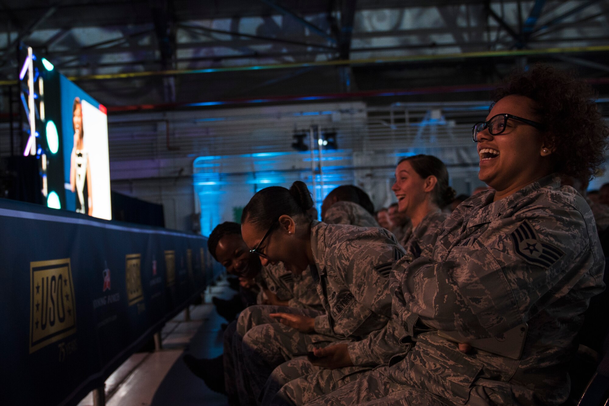 Airmen laugh in the crowd during the ‘Celebration of Service’ comedy show on Joint Base Andrews, Md., May 5, 2016. The show celebrated Military Appreciation Month, the 5th Anniversary of Joining Forces and the 75th Anniversary of the USO. Nearly 1,500 service members, veterans and their families were on hand to see performances by Judd Apatow, Mike Birbiglia, Kristen Schaal, Hasan Minhaj, John Mulaney and Jeff Ross. (U.S. Air Force photo by Airman 1st Class Philip Bryant)