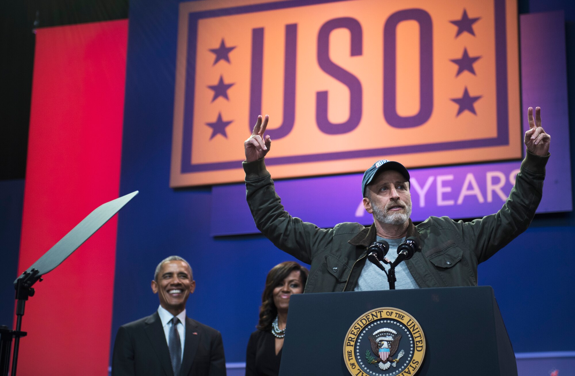 Jon Stewart, comedian and master of ceremonies, speaks at the ‘Celebration of Service’ comedy show on Joint Base Andrews, Md., May 5, 2016. The show celebrated Military Appreciation Month, the 5th Anniversary of Joining Forces and the 75th Anniversary of the USO. The event was hosted by comedian Jon Stewart and featured remarks from the President, Vice President, the First Lady and Dr. Biden. (U.S. Air Force photo by Airman 1st Class Philip Bryant) 