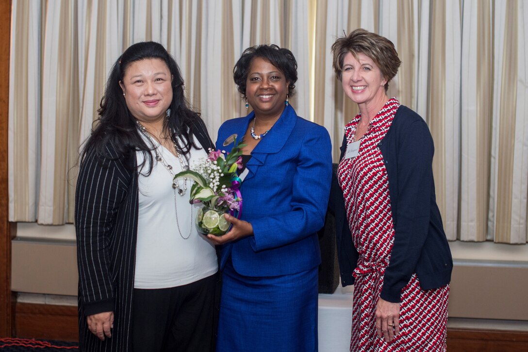 Sue Hoppin (left), National Military Spouse Network founder and president, Diane Webber (center), 11th Force Support Squadron work life specialist, and Jill Hoagland, military spouse, pose for a photo following a Military Spouse Appreciation Day luncheon at The Club on Joint Base Andrews, Md., May 6, 2016. Hoppin was a guest speaker for the event. She discussed the importance of having a work-life balance. (U.S. Air Force photo by Senior Airman Ryan J. Sonnier/RELEASED)