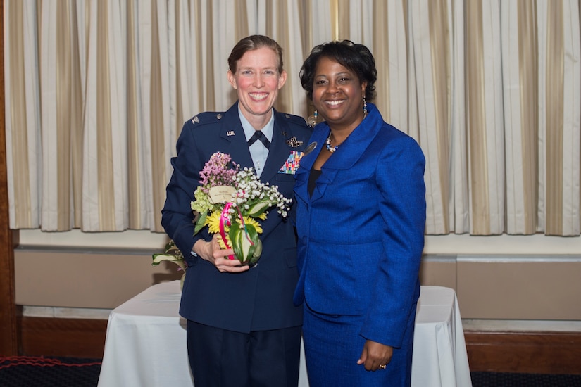 Col. Julie Grundahl (left), 11th Wing vice commander, poses for a photo with Diane Webber, 11th Force Support Squadron work life specialist, during a Military Spouse Appreciation Day luncheon at The Club on Joint Base Andrews, Md., May 6, 2016. Grundahl was a guest speaker for the event and shared her experience as a spouse. (U.S. Air Force photo by Senior Airman Ryan J. Sonnier/RELEASED)