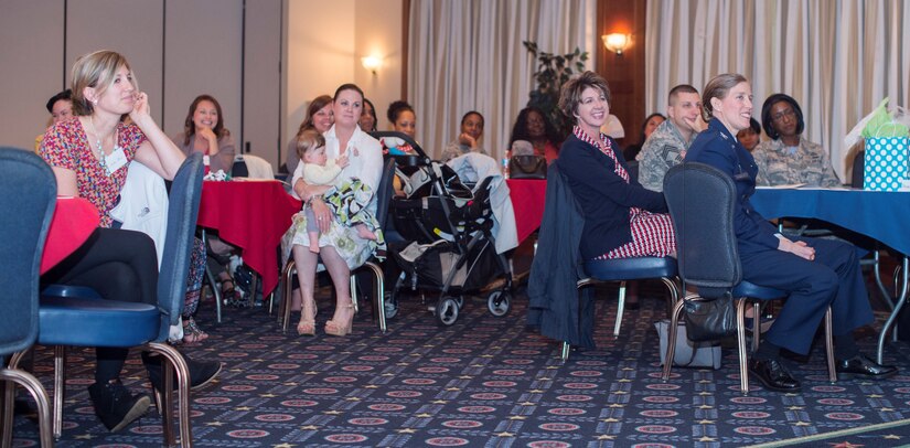 Military Spouse Appreciation Day luncheon attendees smile and listen during guest speaker Sue Hoppin’s speech at The Club on Joint Base Andrews, Md., May 6, 2016. Hoppin, National Military Spouse Network founder and president, discussed the importance of networking and having a work-life balance. (U.S. Air Force photo by Senior Airman Ryan J. Sonnier/RELEASED)