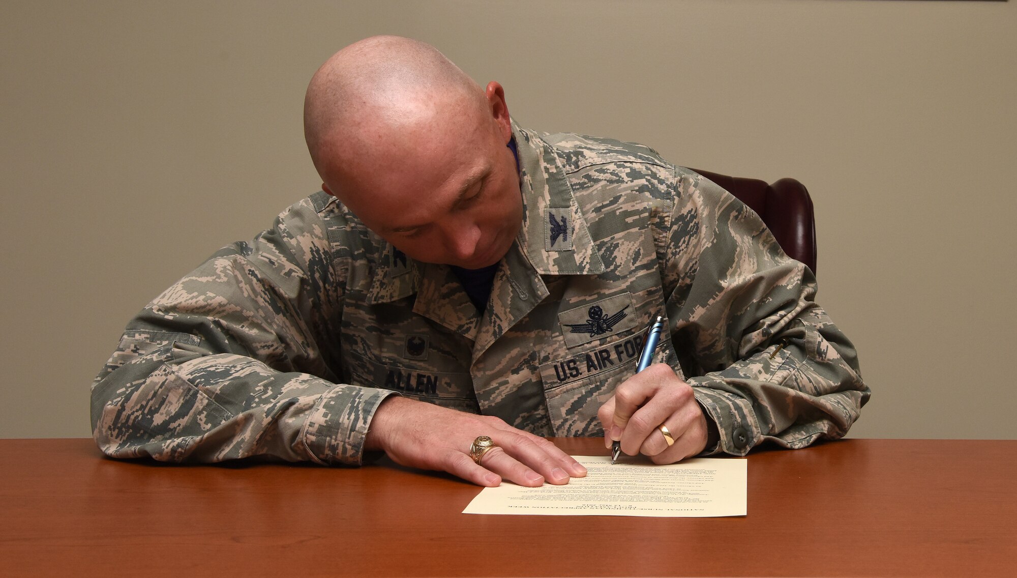 Col Ronald G. Allen, Jr., 341st Missile Wing commander, signs a proclamation May 6, 2016, at Malmstrom Air Force Base, Mont. The proclamation was signed to show appreciation for the Air Force Medical Service's Nursing Services personnel for every opportunity throughout the year. (U.S. Air Force photo/Senior Airman Jaeda Tookes)
