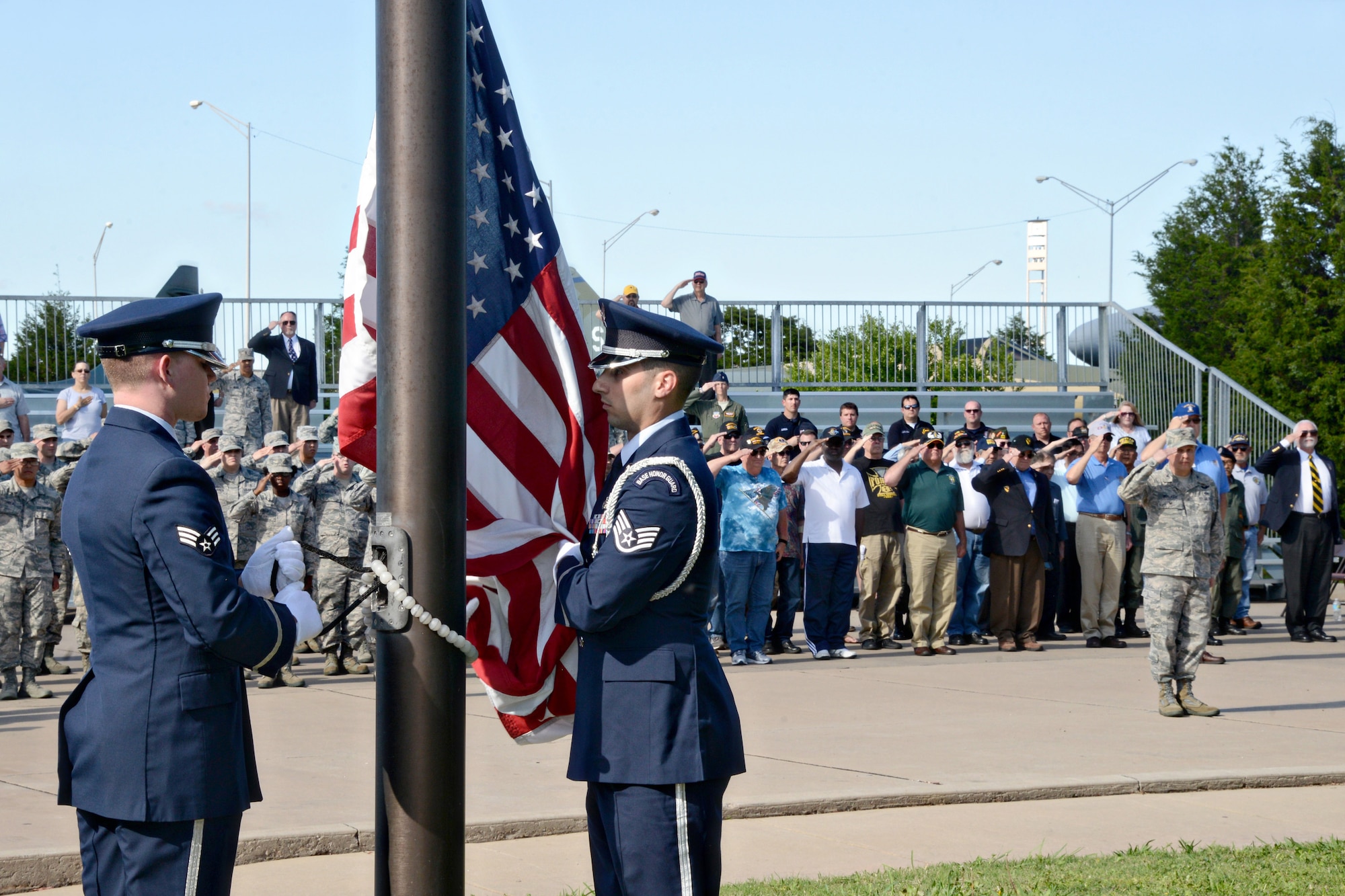 Members of the Tinker Honor Guard lowered the flag and performed a flag folding ceremony to honor veterans of the Vietnam War before base officials, special guests and a formation comprised of Tinker Airmen and Vietnam veterans. (Air Force photo by Kelly White/Released)
