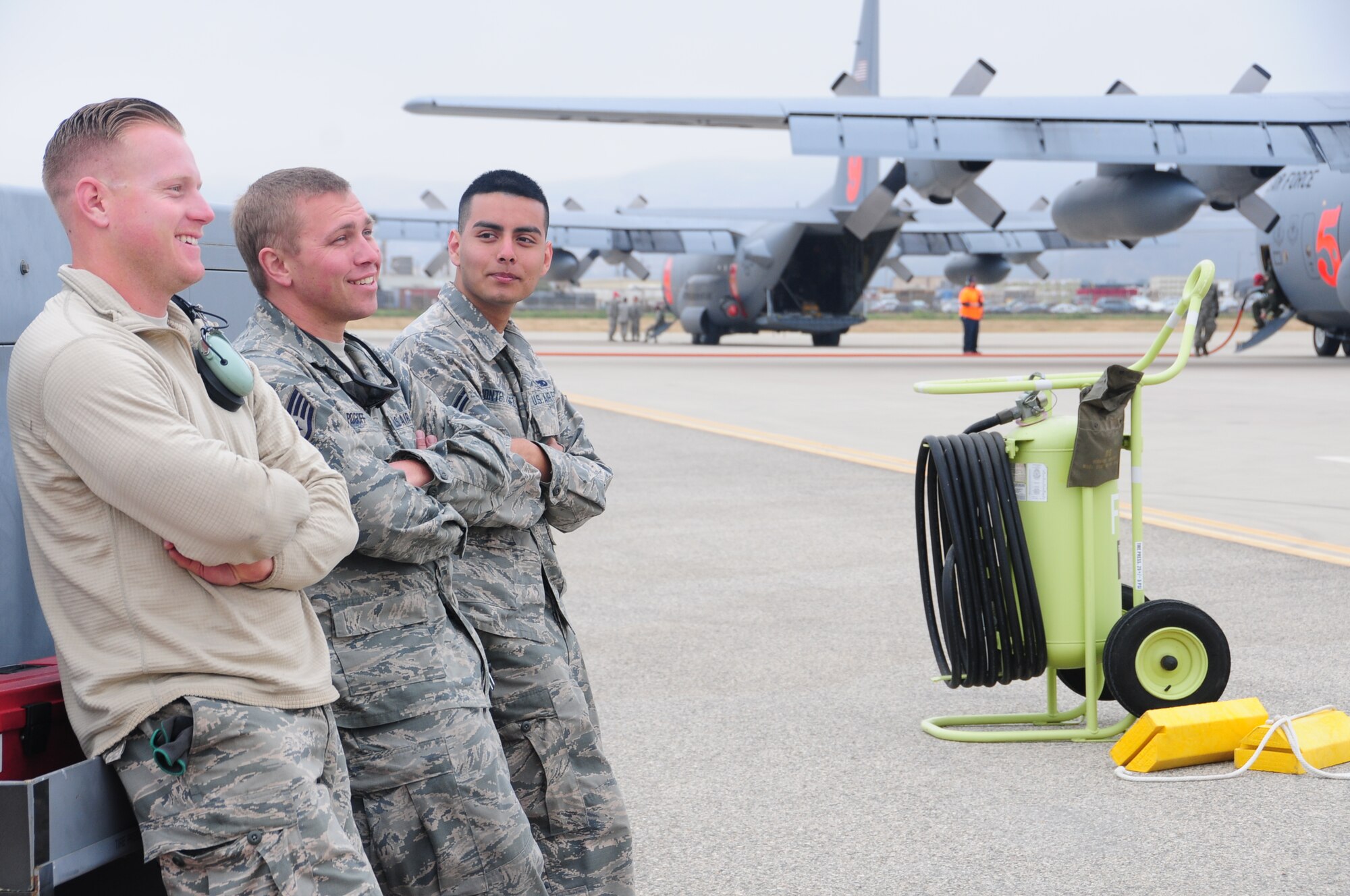U.S. Air National Guard Airman 1st Class Shane McGlashan, Staff Sgt. David Rogoff, and Airman 1st Class Alajandro Montez Alvarez, crew chiefs from the 146th Airlift Wing, Participate in MAFFS annual training at the 146th Airlift Wing in Port Hueneme, California on May 4, 2016. (U.S. Air National Guard photo by Senior Airman Madeleine Richards/Released)

