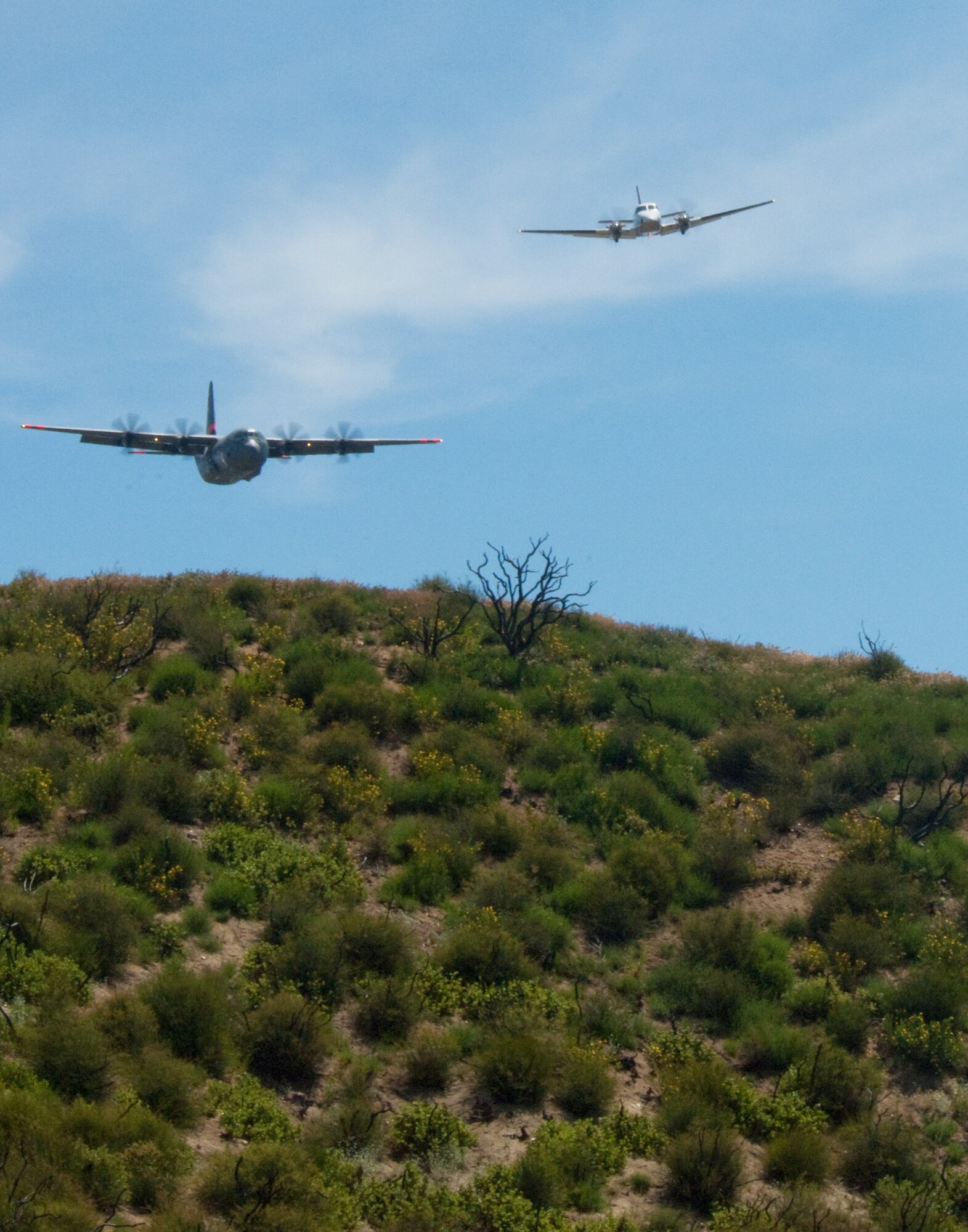 An Air National Guard C-130 containing the MAFFS (Modular Airborne Firefighting System) ,a system used to combat wildfires, simulated a retardant drop during annual MAFFS training at the 146th Airlift Wing in Port Hueneme, California on May 3 2016. (U.S. Air National Guard photo by Staff Sgt. Nicholas Carzis) 