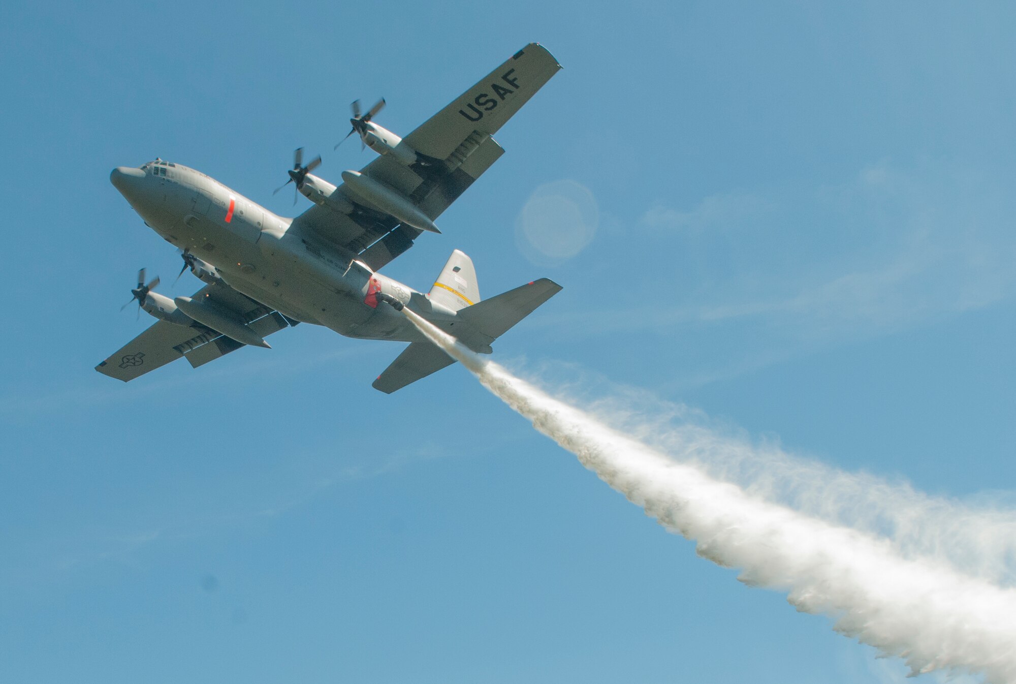 A 153rd Airlift Wing C-130 performs water drop training in southern California on Tuesday, May 3, 2016. The training was conducted at Channel Islands Air National Guard Station, Calif., for the mission’s annual certification. Since 1974, MAFFS — a fire retardant delivery system inserted into C-130 aircraft — has been a joint effort including the U.S. Forest Service and the Department of Defense to fight wildland fires. The training ends Friday. (U.S. Air Force photo by Tech. Sgt. Emerson Marcus/released)