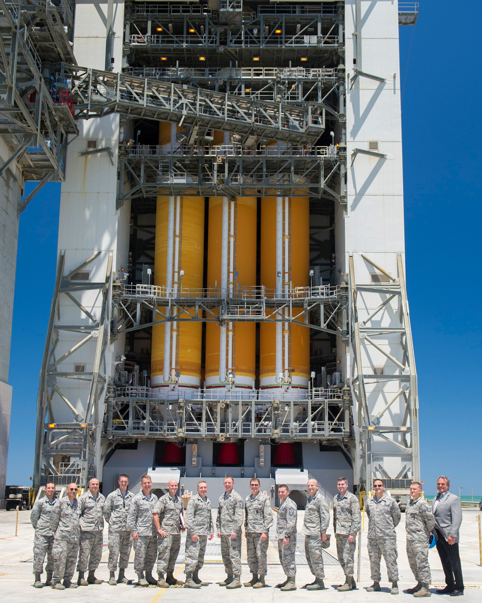 Members of the 45th Launch Group, wing staff and ULA pose in front of the United Launch Alliance Delta IV heavy rocket on Space Launch Complex 37 at Cape Canaveral Air Force Station May 5, 2016. Lt. Gen. David J. Buck, commander, 14th Air Force (Air Forces Strategic), Air Force Space Command; and commander, Joint Functional Component Command for Space, U.S. Strategic Command, and Chief Master Sgt. Craig Neri, 14th AF command chief and command senior enlisted leader for JFCC Space, visited Patrick Air Force Base and Cape Canaveral Air Force Station May 4 and 5 and gained insight into the contributions Airmen across the wing make to keep the 45th Space Wing the World's Premier Gateway to Space. (U.S. Air Force photo by Matthew Jurgens/Released)