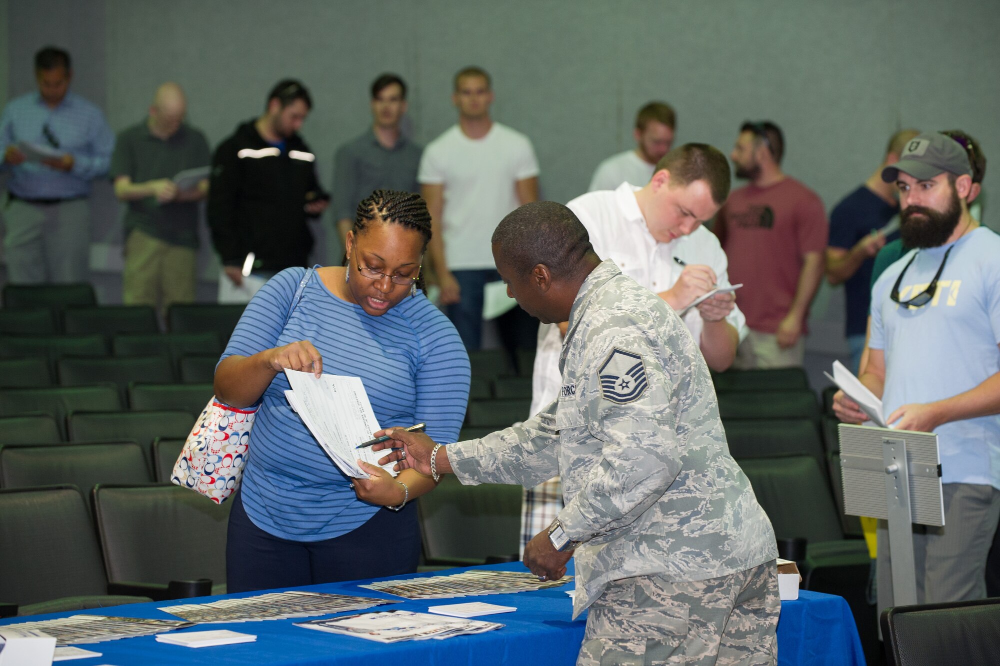 Individual Ready Reserve Muster attendees gather in the base theater to process through required stations here at Patrick Air Force Base, Fla., May 6, 2016. The stations the attendees process through include medical, Air Force Reserve recruiting, Veteran's Assistance benefits, and military identification. (U.S. Air Force photo/Benjamin Thacker) (Released)
