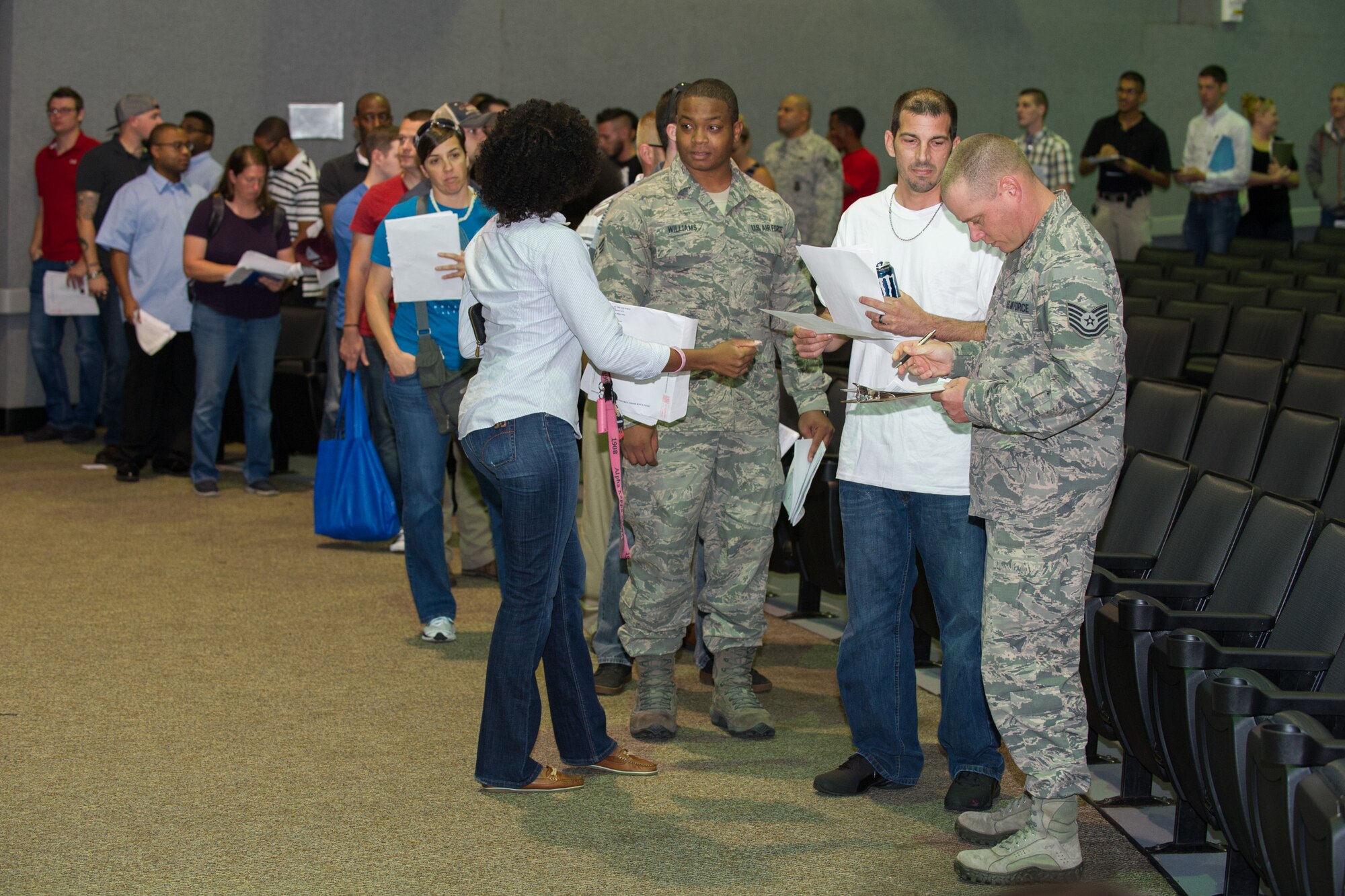 Individual Ready Reserve Muster attendees gather in the base theater to process through required stations here at Patrick Air Force Base, Fla., May 6, 2016. The stations the attendees process through include medical, Air Force Reserve recruiting, Veteran's Assistance benefits, and military identification. (U.S. Air Force photo/Benjamin Thacker) (Released)