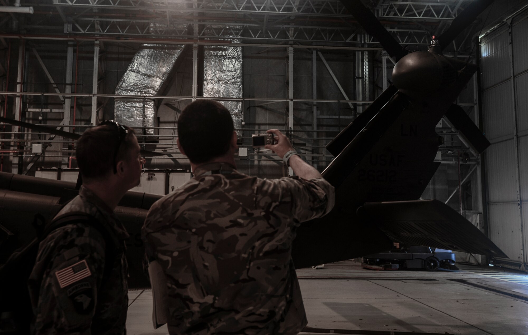 An HH-60G Pave Hawk is photographed by U.K. Joint Arms Control Implementation Group and Defense Threat Reduction Agency-On Site Europe team members during a Conventional Armed Forces in Europe exercise inspection at Royal Air Force Lakenheath, England, March 28, 2016. The CFE treaty was negotiated during the final years of the Cold War to limit the amount of combat equipment a nation had in their inventory, and provides for an inspection regime to verify holdings. (U.S. Air Force photo by Senior Airman Dawn M. Weber/Released)