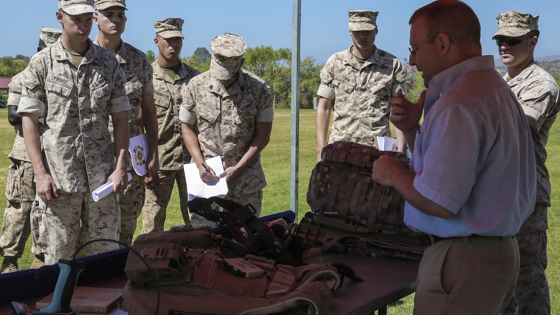 Marines learn about the Joint Infantry Company Prototype during the Expeditionary Energy Concepts symposium at Marine Corps Base Camp Pendleton, California, May 3, 2016. The JIC-P is a wearable energy management system that uses multiple sources, including kinetic harvesting, to recharge batteries in radios and other equipment that cuts down the amount of weight each Marine has to carry and eliminates the need to frequently resupply forward units with fresh batteries. E2C features new technologies developed by outside companies to improve the reach and effectiveness of the Marine Corps. The three-day event also gives Marines who would work with the technology on a daily basis the opportunity to identify possible areas for improvement.