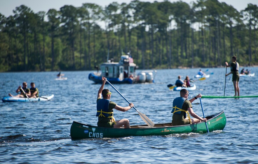 Team Eglin Marines paddle a canoe in the waters of Post'l Point during the 96th Force Support Squadron’s Mission Breakfast May 4 at Eglin Air Force Base, Fla. The 96th FSS’s Outdoor Recreation provided free boat and equipment rentals for the day. (U.S. Air Force photo/Ilka Cole) 