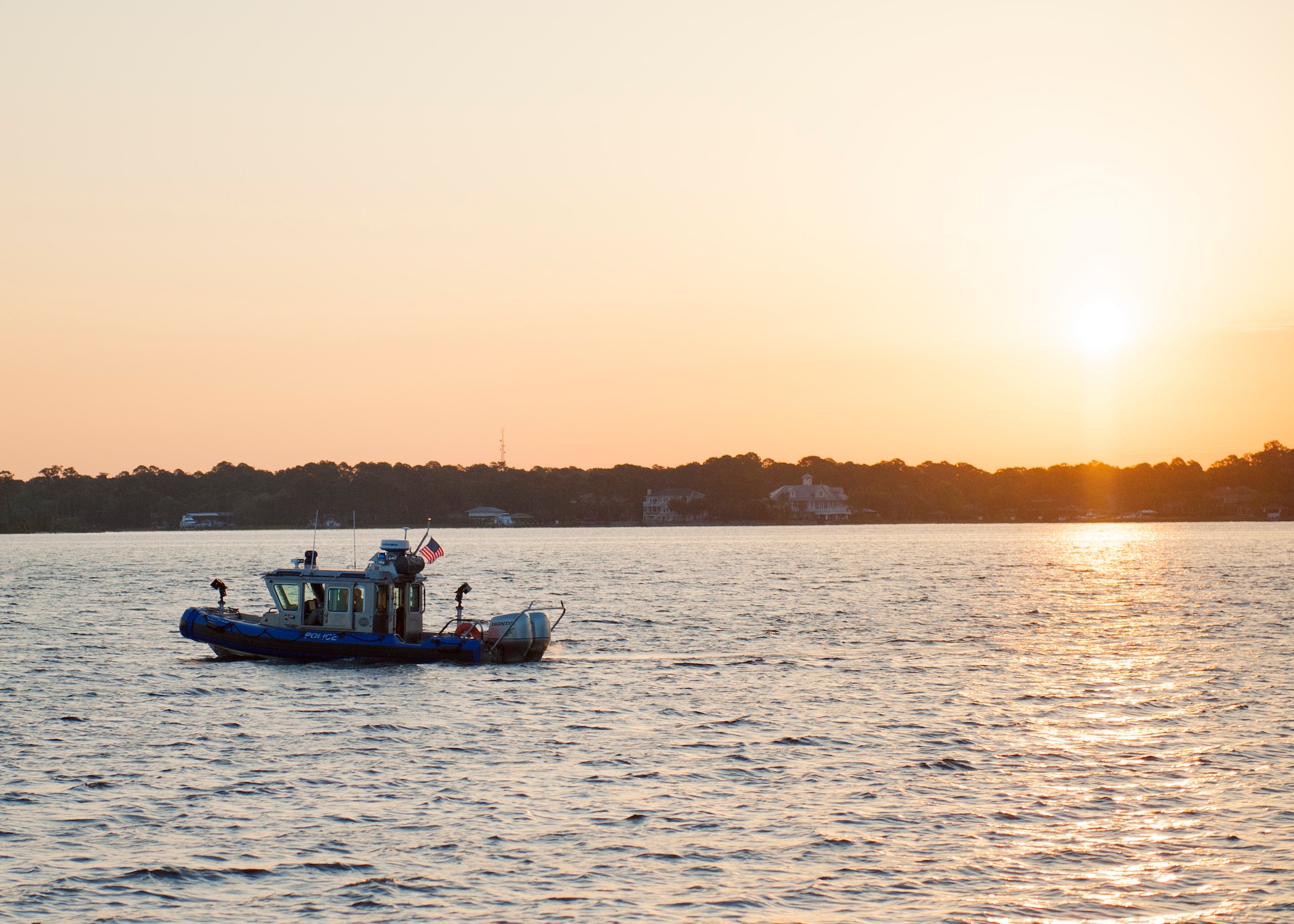 The 96th Security Forces Squadron’s boat patrol, Nathan-25 patrols the waters of Post’l Point at sunrise before the 96th Force Support Squadron’s Mission Breakfast May 4 at Eglin Air Force Base Fla.  The boat patrol monitors Eglin’s 153 mile coastline. (U.S. Air Force photo/Ilka Cole)
