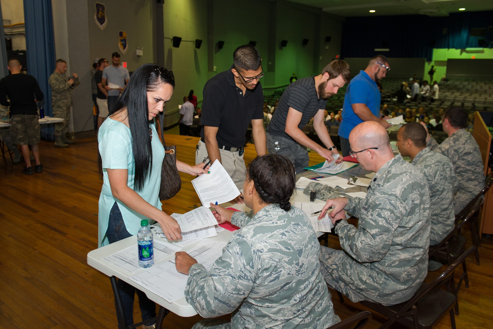 Individual Ready Reserve Muster attendees gather in the base theater to process through required stations here at Patrick Air Force Base, Fla., May 6, 2016. The stations the attendees process through include medical, Air Force Reserve recruiting, Veteran's Assistance benefits, and military identification. (U.S. Air Force photo/Benjamin Thacker) (Released)