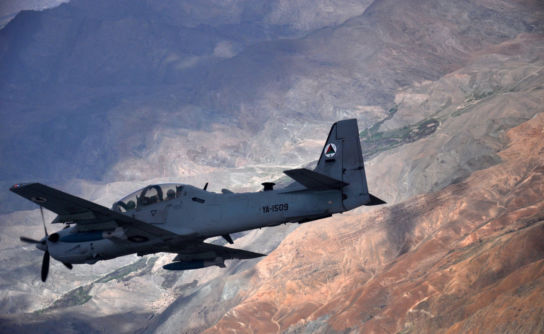 An Afghan air force A-29 Super Tucano aircraft flies over Afghanistan during a training mission, April 6, 2016. NATO Train, Advise, Assist Command-Air works daily to assist the Afghan air force in improving its capabilities. (Air Force photo by Capt. Eydie Sakura) 