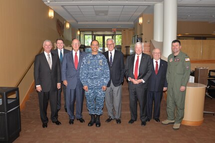 U.S. Navy Adm. Cecil D. Haney, U.S. Strategic Command commander (fourth from left), and U.S. Air Force Col. George M. Reynolds, 55th Wing commander (right), pose for a photo with members of the Strategic Command Consultation (SCC) Committee at the Dougherty Conference Center, Offutt Air Force Base, Neb., May 6, 2015, as part of the commandâ€™s bi-annual SCC update meeting. During the meeting, USSTRATCOM leaders briefed the SCC members on command events, issues and priorities. The SCC is comprised of Omaha-area senior business and community leaders who partner with USSTRATCOM on command initiatives, including the Omaha Trophy award. One of nine DoD unified combatant commands, USSTRATCOM has global strategic missions, assigned through the Unified Command Plan, which include strategic deterrence; space operations; cyberspace operations; joint electronic warfare; global strike; missile defense; intelligence, surveillance and reconnaissance; combating weapons of mass destruction; and analysis and targeting. (USSTRATCOM photo by Dana Heard)