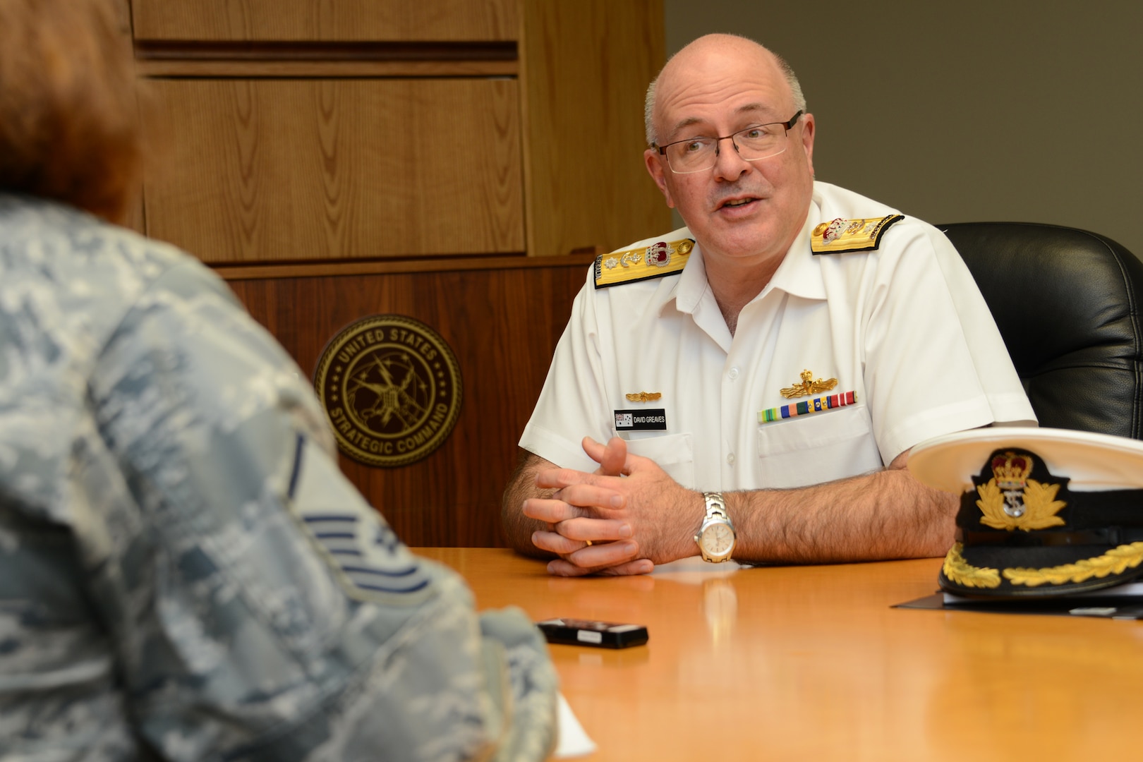 Royal Australian Navy Commodore David Greaves, Australian Chief Information Officer Group strategic communications branch commander, answers questions during an interview at U.S. Strategic Command (USSTRATCOM) Headquarters, Offutt Air Force Base, Neb., May 6, 2016. While here, Greaves held discussions with senior leaders and subject matter experts from USSTRATCOMâ€™s command, control, communications, and computers (C4) directorate, on the status of current satellite communications agreements between Australia and the U.S., as well as future arrangements. The visit is part of USSTRATCOM'S ongoing effort to build, sustain and support partnerships with allied nations. One of nine DoD unified combatant commands, USSTRATCOM has global strategic missions, assigned through the Unified Command Plan, which include strategic deterrence; space operations; cyberspace operations; joint electronic warfare; global strike; missile defense; intelligence, surveillance and reconnaissance; combating weapons of mass destruction; and analysis and targeting. (U.S. Navy photo by Mass Communication Specialist 1st Class Byron C. Linder/Released)