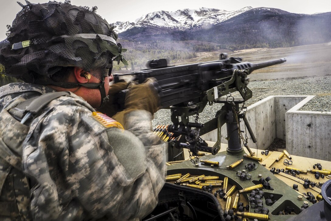 Army Spc. Dillon Weitzel fires at targets on an M2 .50-caliber machine gun range at Joint Base Elmendorf-Richardson, Alaska, April 26, 2016. Weitzel is a paratrooper assigned to the 25th Infantry Division’s 40th Cavalry Regiment, 4th Brigade Combat Team (Airborne), Alaska. Air Force photo by Justin Connaher