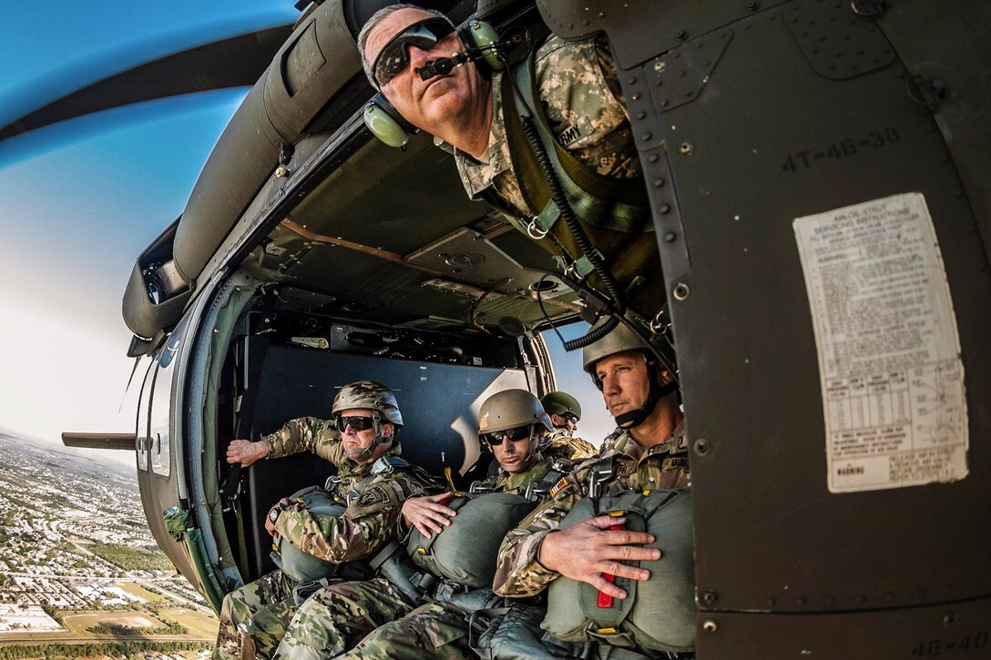 Soldiers conduct airborne operations from a UH-60 Black Hawk helicopter piloted by a Florida National Guard helicopter crew over Brooksville, Fla., April 23, 2016. The soldiers are assigned to U.S. Special Operations Command. Army photo by Ching Oettel