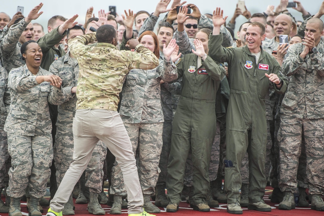 Actor Anthony Mackie high-fives airmen at Joint Base Langley-Eustis, Va., May 4, 2016. Mackie surprised the airmen on live television as part of ABC’s "Good Morning America" broadcast. Air Force photo by Senior Airman Kayla Newman