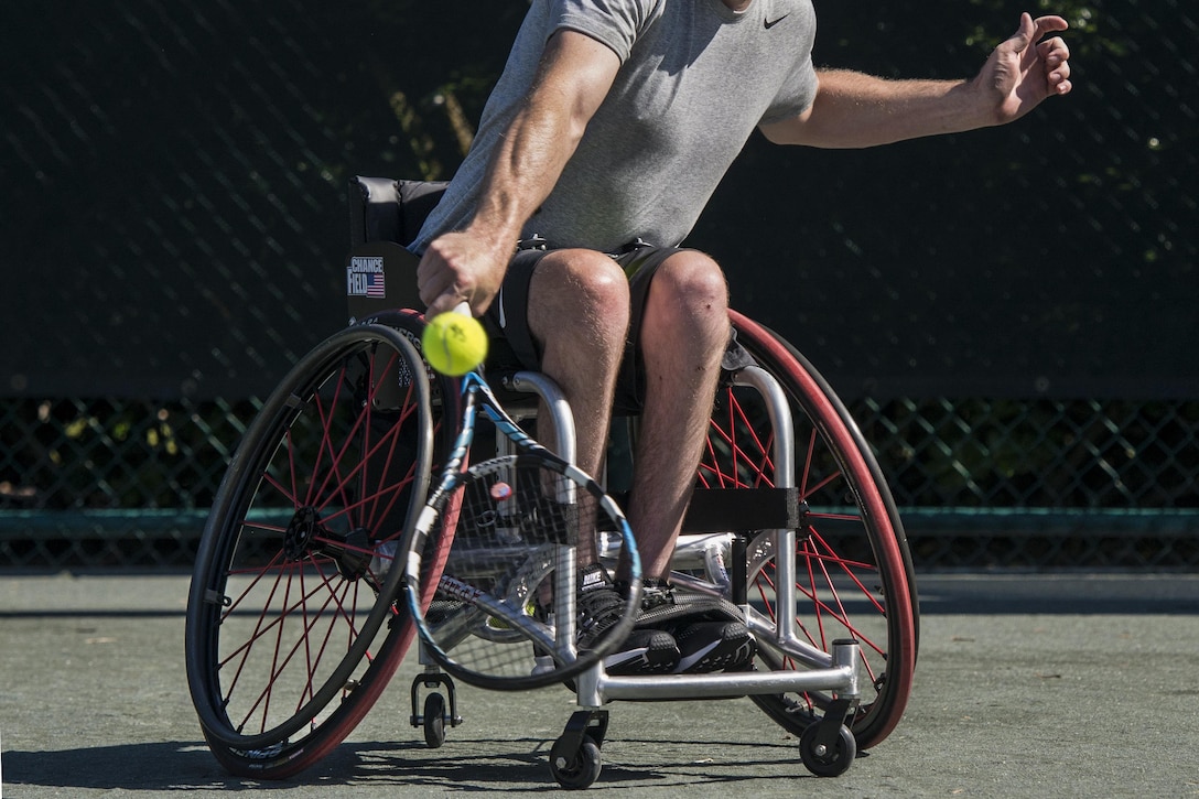 Retired Navy Seaman Austin Field trains in wheelchair tennis for the 2016 Invictus Games at the ESPN Wide World of Sports complex at Walt Disney World in Orlando, Fla., May 5, 2016. Preliminary rounds of competition between teams from 15 countries have started in 10 sports for the event, which runs through May 12. Photo by Roger Wollenberg