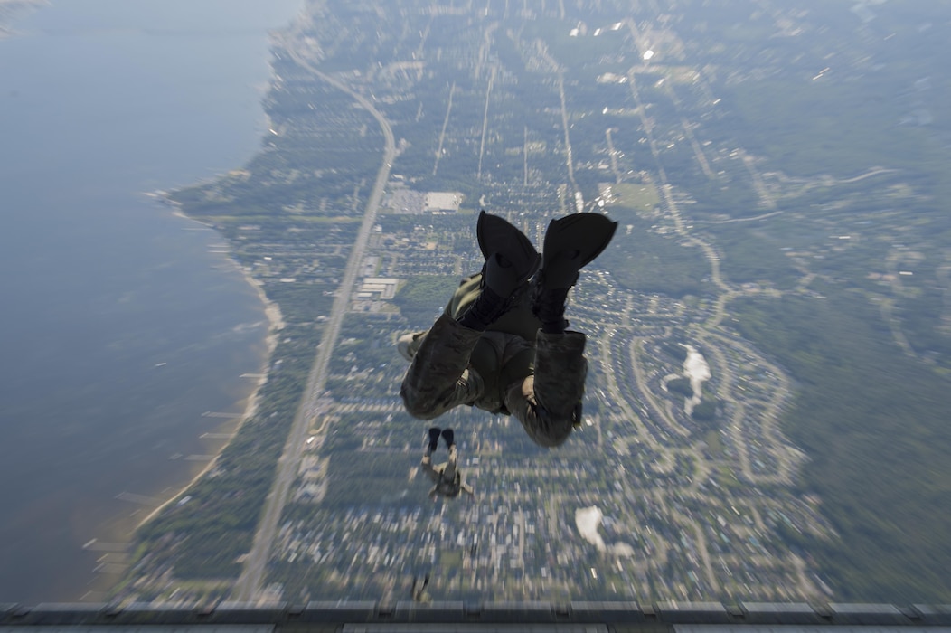 Pararescuemen and combat controllers from the 21st Special Operations Squadron and 22nd SOS, jump out of a MC-130J Commando II at Hurlburt field, Fla., May 4, 2016 during Emerald Warrior. (U.S. Air Force photo by Staff Sgt. Paul Labbe)