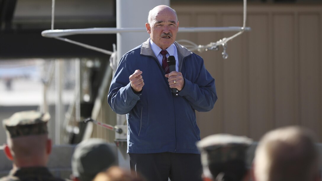 The Honorable Dennis V. McGinn, Assistant Secretary of the Navy, addresses distinguished guests and personnel of the Combat Center at Lance Cpl. Torrey L. Gray Field, Jan. 21, 2016. McGinn visited the Combat Center to award Exercise Support Division the 2015 Secretary of the Navy Energy and Water Management Award in the United States Marine Corps Expeditionary category. McGinn also recognized the Combat Center as an installation, for a Gold Level of Achievement under the awards program, which indicates a very good to outstanding energy or water program.