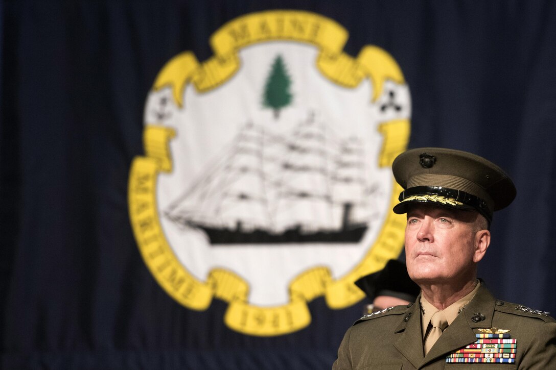 Marine Corps Gen. Joe Dunford, chairman of the Joint Chiefs of Staff, listens to Dr. William J. Brennan, president of the Maine Maritime Academy at Alexander Field House in Castine, Maine, May 7, 2016. Dunford was the keynote speaker at the 2016 Maine Maritime Academy commencement. DoD photo by Navy Petty Officer 2nd Class Dominique A. Pineiro