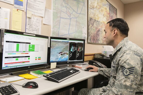U.S. Air Force Staff Sgt. Joey Putis, an 18th Operations Support Squadron (OSS) weather technician assigned to Kadena Air Base, Japan, checks weather conditions to build a briefing slide, May 4, 2016, at Eielson Air Force Base, Alaska. Putis works with members from the 354th OSS to deliver accurate weather conditions to pilots participating in RED FLAG-Alaska 16-1 from Eielson and Joint Base Elmendorf-Richardson. (U.S. Air Force photo by Staff Sgt. Ashley Nicole Taylor/Released)