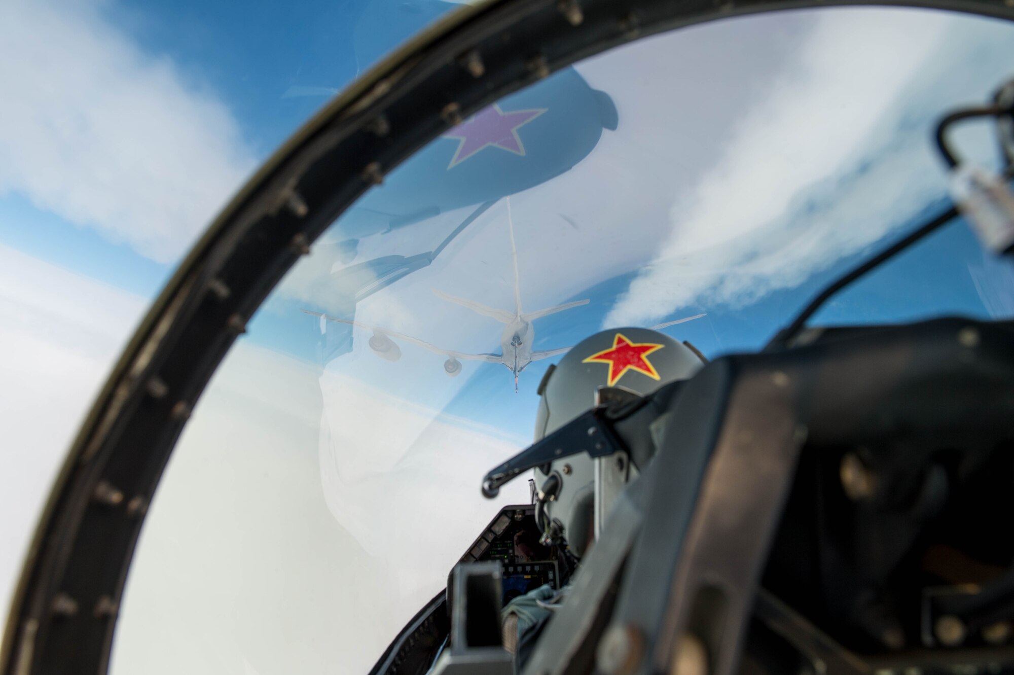 U.S. Air Force Capt. John Peskar, 18th Aggressor Squadron pilot, prepares to refuel an F-16 Fighting Falcon from a KC-135 Stratotanker assigned to the 22nd Air Refueling Wing McConnell Air Force Base, Kansas, May 3, 2016, during RED FLAG-Alaska (RF-A) 16-1 at Eielson Air Force Base, Alaska. RF-A is a Pacific Air Forces command directed field training exercise for U.S. and allied forces, to provide joint offensive counter-air, interdiction, close air support and large force employment training in a simulated combat environment. (U.S. Air Force photo by Staff Sgt. Shawn Nickel/Released)
