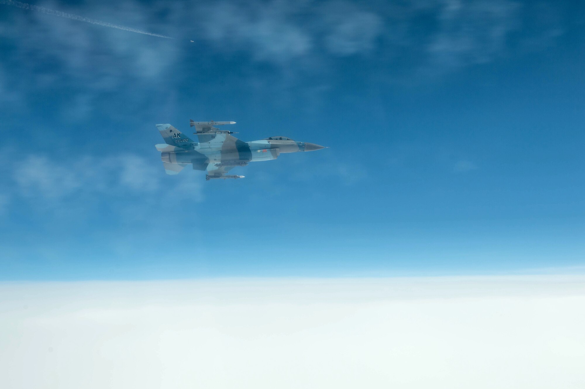 U.S. Air Force Maj. Scott Meng, 18th Aggressor Squadron pilot, banks away from a simulated threat while training May 3, 2016, during RED FLAG-Alaska (RF-A) 16-1 at Eielson Air Force Base, Alaska. Twenty three units from around the world participated in RF-A 16-1, a Pacific Air Forces command directed field training exercise for U.S. and allied forces, to provide joint offensive counter-air, interdiction, close air support and large force employment training in a simulated combat environment. (U.S. Air Force photo by Staff Sgt. Shawn Nickel/Released)