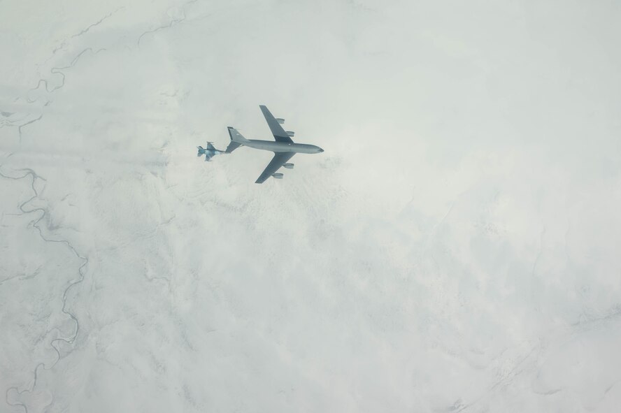 U.S. Air Force Maj. Scott Meng, 18th Aggressor Squadron pilot, refuels an F-16 Fighting Falcon from a KC-135 Stratotanker assigned to the 22nd Air Refueling Wing McConnell Air Force Base, Kansas, May 3, 2016, during RED FLAG-Alaska (RF-A) 16-1 at Eielson Air Force Base, Alaska. RF-A is a Pacific Air Forces command directed field training exercise for U.S. and allied forces, to provide joint offensive counter-air, interdiction, close air support and large force employment training in a simulated combat environment. (U.S. Air Force photo by Staff Sgt. Shawn Nickel/Released)