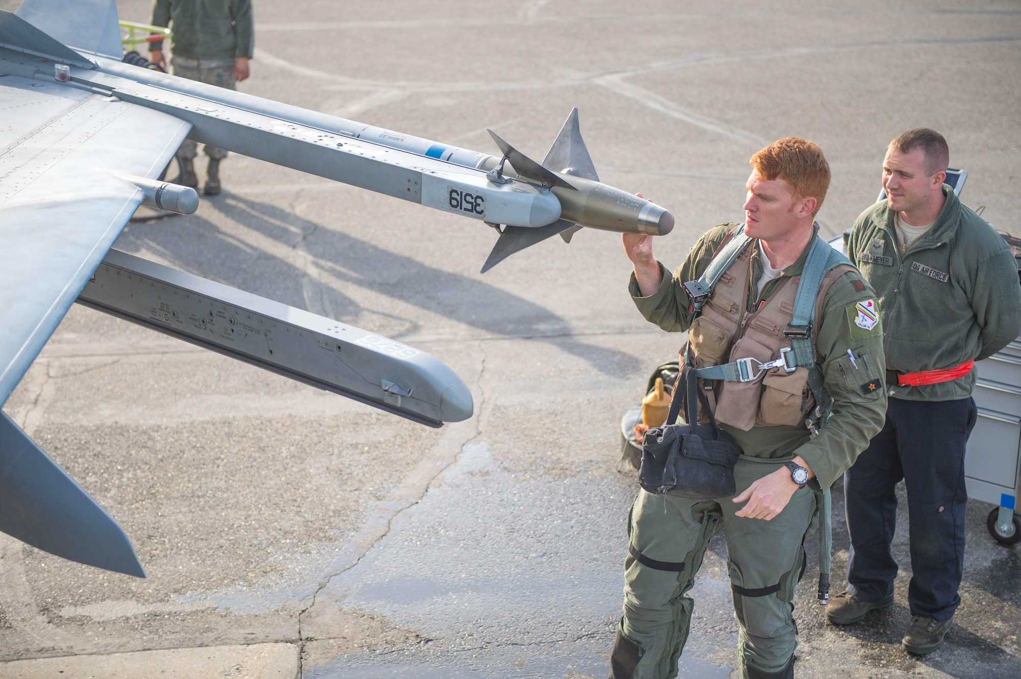 U.S. Air Force Maj. Ryan Busbey, an 18th Aggressor Squadron pilot, conducts a pre-flight check on the F-16 Fighting Falcon aircraft May 4, 2016, on Eielson Air Force Base, Alaska. Busbey will fly training missions during RED FLAG-Alaska (RF-A) 16-1; a Pacific Air Forces command directed field training exercise for U.S. and allied forces, to provide joint offensive counter-air, interdiction, close air support and large force employment training in a simulated combat environment. (U.S. Air Force photo by Staff Sgt. Shawn Nickel/Released)