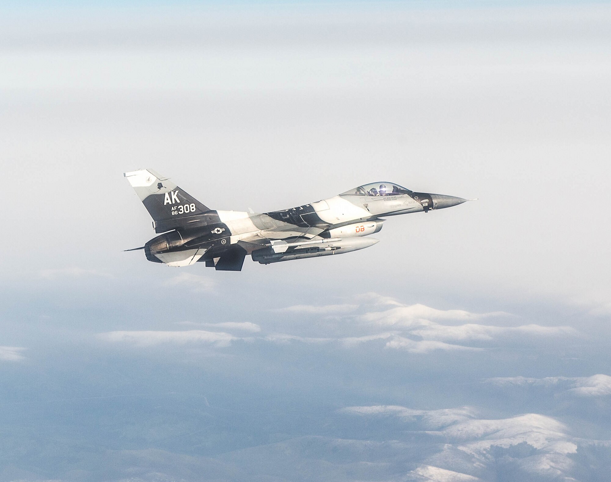 U.S. Air Force Maj. Jeromy Guinther, an 18th Aggressor Squadron pilot, flies an F-16 Fighting Falcon aircraft May 4, 2016, over the Joint Pacific Alaska Range Complex (JPARC), during RED FLAG-Alaska (RF-A) 16-1. Sorties for RF-A are flown in the JPARC, a more than 67,000 square mile area that provides a realistic training environment and allows commanders to train for full spectrum engagements, ranging from individual skills to complex, large-scale joint engagements. (U.S. Air Force photo by Staff Sgt. Shawn Nickel/Released)