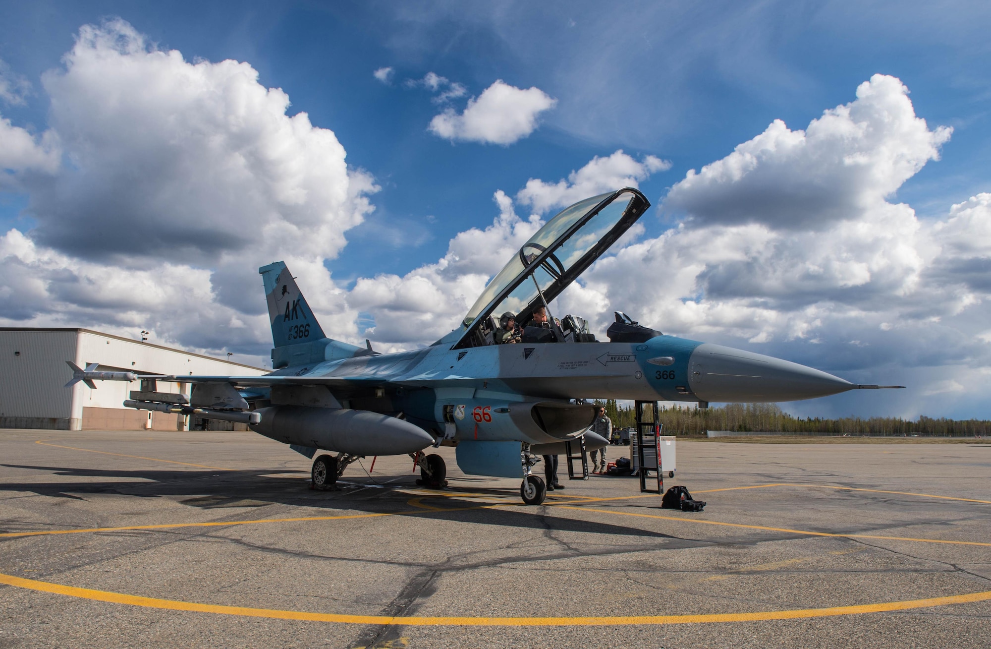 U.S. Air Force Maj. Michael Kuzmuk, an 18th Aggressor Squadron pilot, and 1st Class Victoria Ortaleza, a 354th Aircraft Maintenance Squadron electronic and environmental systems journeyman, prepare to take off in the F-16D Fighting Falcon aircraft they will fly in at Eielson Air Force Base, Alaska, May 4, 2016, during a RED FLAG-Alaska (RF-A) 16-1 sortie. With more than 500 tactical flying hours logged during each RF-A, maintainers work around the clock on various systems, each requiring specialized Airman like Ortaleza who is responsible for working on the environmental control systems, which controls pressurization, heating and cooling throughout the equipment and cockpit, as well as oxygen systems. (U.S. Air Force photo by Staff Sgt. Shawn Nickel/Released) 