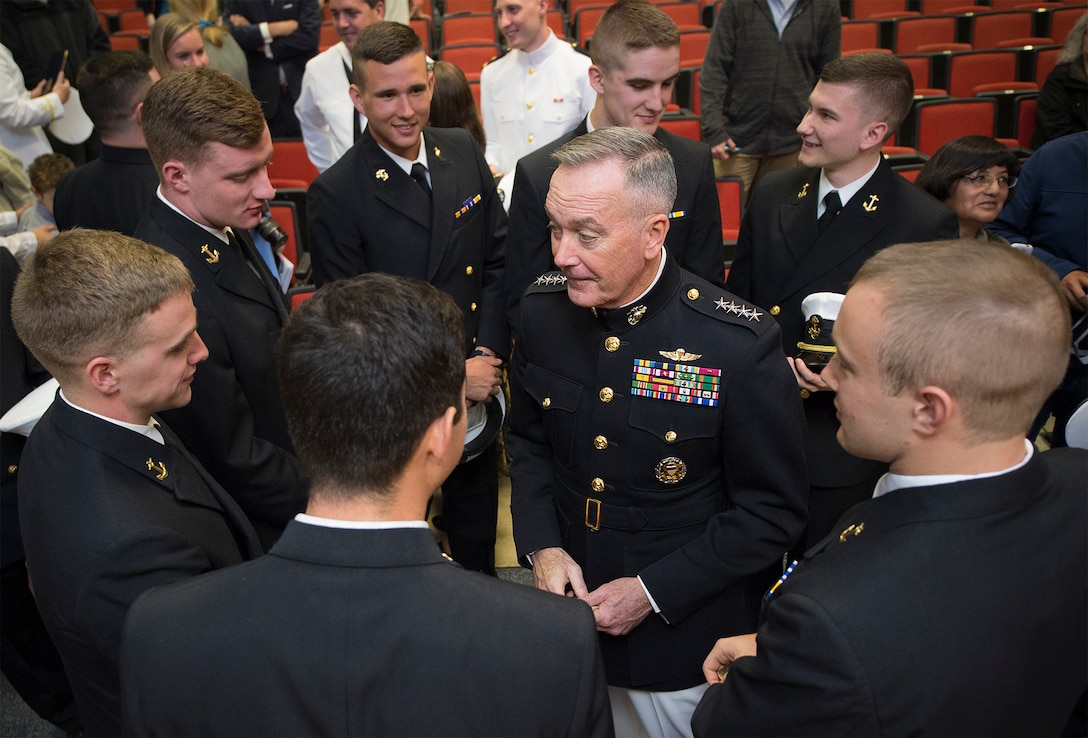 Marine Corps Gen. Joe Dunford, center, chairman of the Joint Chiefs of Staff, speaks with Maine Maritime Academy Naval ROTC midshipmen following a commissioning ceremony in Castine, Maine, May 7, 2016. DoD photo by Navy Petty Officer 2nd Class Dominique A. Pineiro