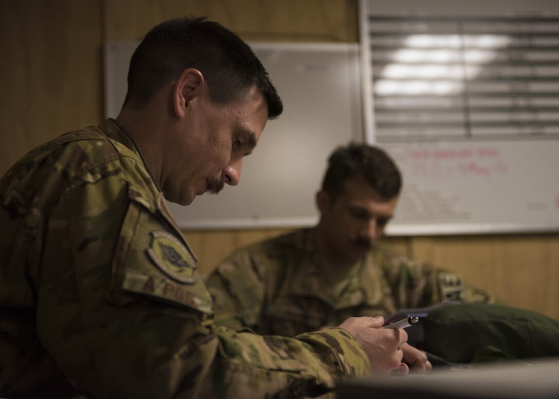 Capt. Michael Pieschel, 455th Expeditionary Aeromedical Evacuation Squadron, looks over his notes during the crew brief at Bagram Airfield, Afghanistan, May 05, 2016. Members of the 455th Expeditionary Aeromedical Evacutation Squadron routinely move critically ill servicemembers after they’ve been stabilized or received damage-control surgery. (U.S. Air Force photo by Senior Airman Justyn M. Freeman)