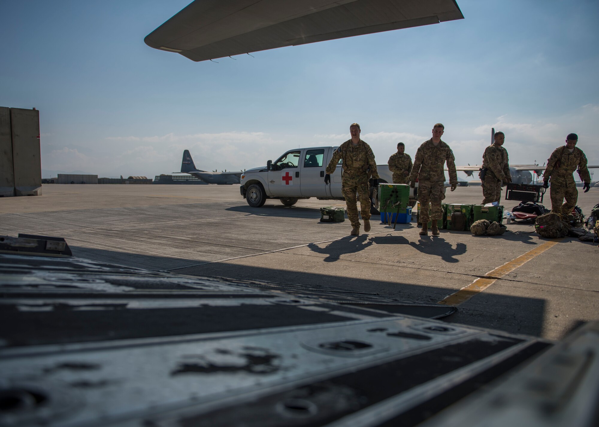 Members of the 455th Expeditionary Aeromedical Evacuation Squadron, carry medical equipment on a C-130J Super Hercules at Bagram Airfield, Afghanistan, May 05, 2016. If Service members must be moved from the battlefield to a medical facility outside of Afghanistan, the airmen assigned to the 455th EAES will be the link between them getting from the combat zone to higher-level medical care. (U.S. Air Force photo by Senior Airman Justyn M. Freeman)