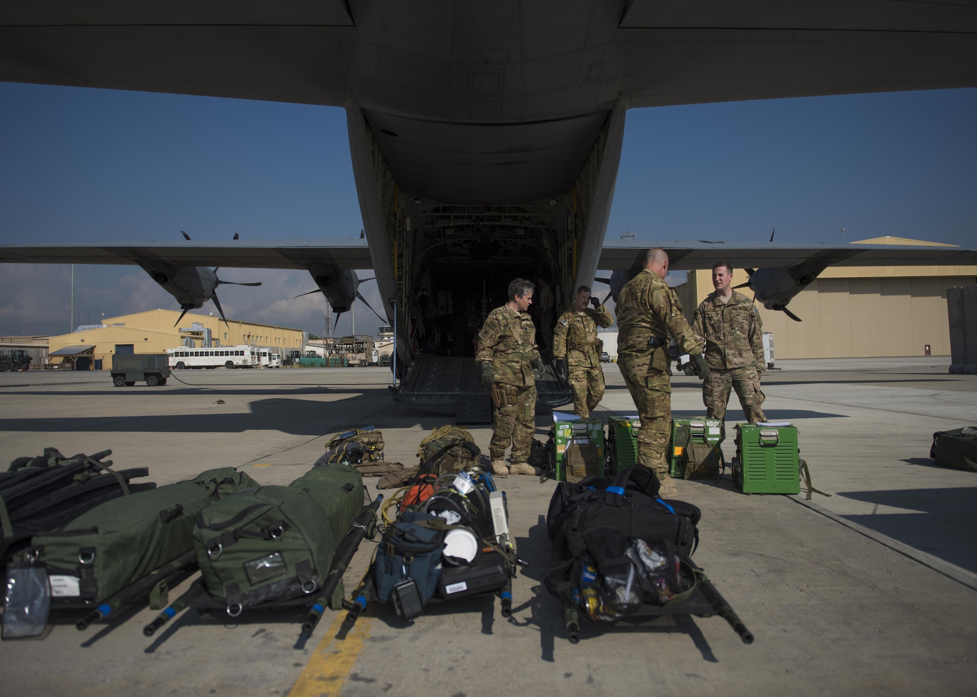 Members of the 455th Expeditionary Aeromedical Evacuation Squadron, carry medical equipment on a C-130J Super Hercules at Bagram Airfield, Afghanistan, May 05, 2016. Members of the 455th Expeditionary Aeromedical Evacutation Squadron routinely move critically ill servicemembers after they’ve been stabilized or received damage-control surgery. (U.S. Air Force photo by Senior Airman Justyn M. Freeman)