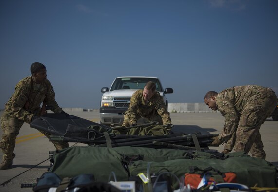 Members of the 455th Expeditionary Aeromedical Evacuation Squadron seperate pieces of a medical stretcher to be loaded on a C-130J Super Hercules at Bagram Airfield, Afghanistan, May 05, 2016. The 455th EAES Airmen are on call and remain ready to transport patients at a moments notice on various Air Force aircraft. (U.S. Air Force photo by Senior Airman Justyn M. Freeman)