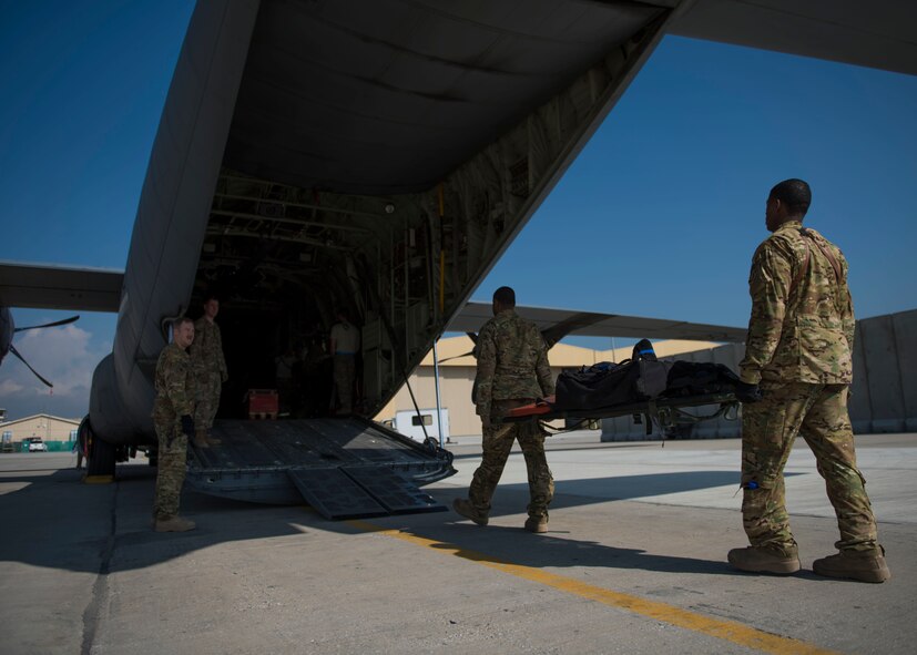 Members of the 455th Expeditionary Aeromedical Evacuation Squadron, carry medical equipment on a C-130J Super Hercules at Bagram Airfield, Afghanistan, May 05, 2016. Members of the 455th Expeditionary Aeromedical Evacutation Squadron routinely move critically ill service members after they’ve been stabilized or received damage-control surgery. (U.S. Air Force photo by Senior Airman Justyn M. Freeman)