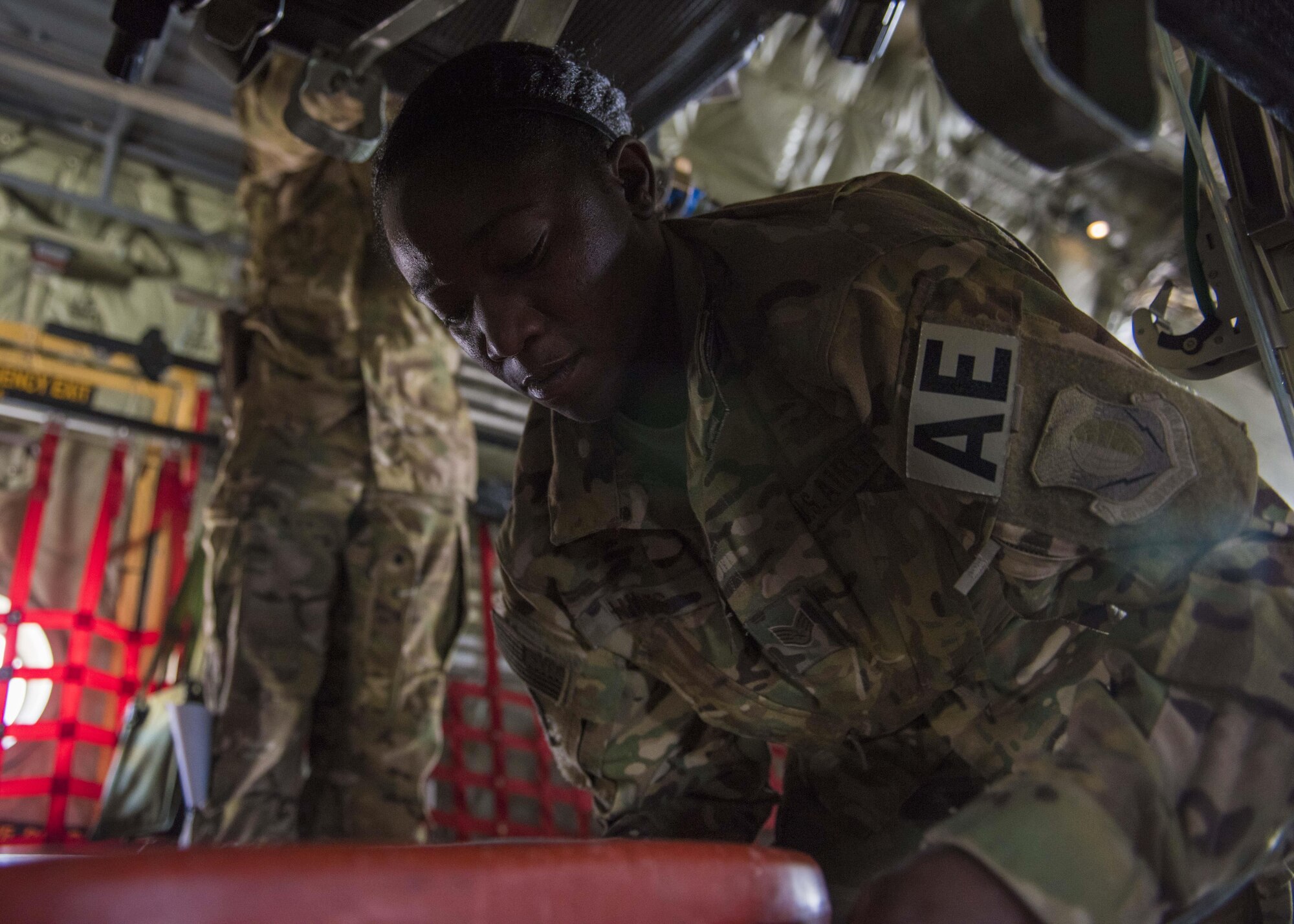 Staff Sgt. Banita Hines, 455th Expeditionary Aeromedical Evacuation Squadron, conducts last minute preparations before takeoff aboard a C-130J Super Hercules at Bagram Airfield, Afghanistan, May 05, 2016. The 455th EAES Airmen are on call and remain ready to transport patients at a moments notice. (U.S. Air Force photo by Senior Airman Justyn M. Freeman)